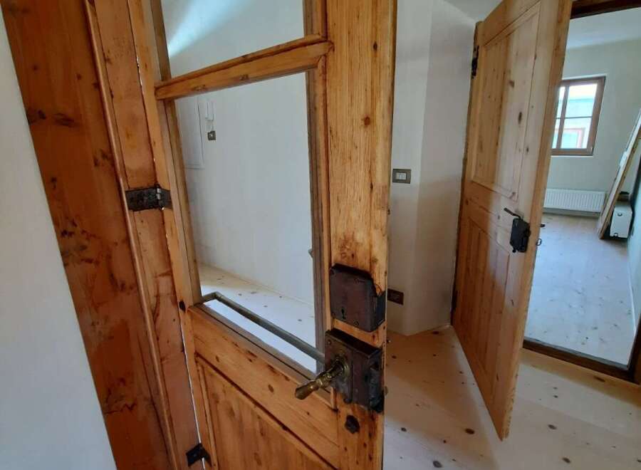 Discover the charm of this property with its beautifully crafted wooden doors.