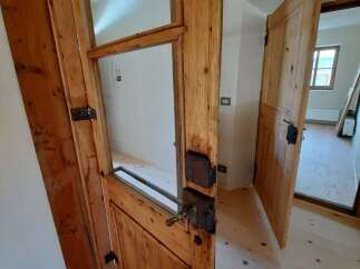 Discover the charm of this property with its beautifully crafted wooden doors.