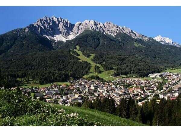 Discover the breathtaking beauty of this mountain town nestled at the foot of majestic peaks.