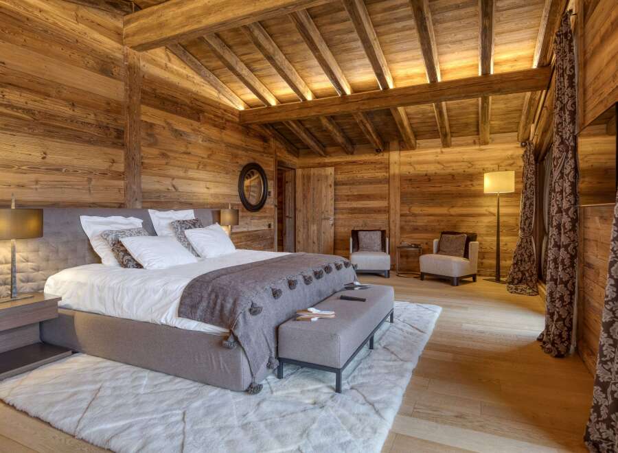Experience rustic luxury in this stunning bedroom.