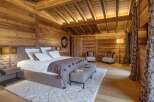 Experience rustic luxury in this stunning bedroom.