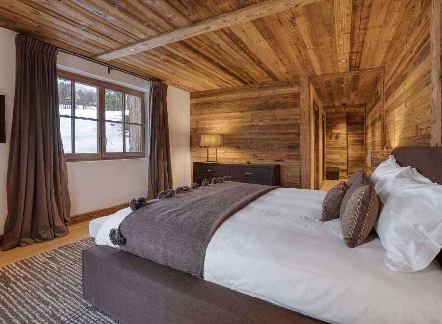 Experience the ultimate in rustic luxury in this stunning bedroom.