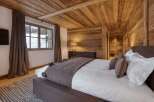 Experience the ultimate in rustic luxury in this stunning bedroom.