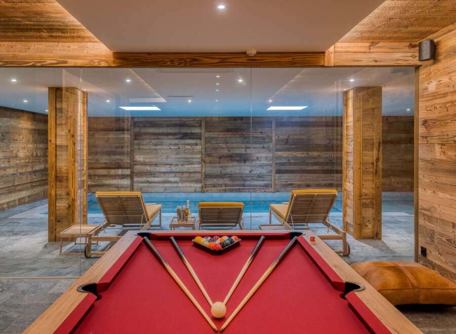 Indulge in luxury with this stunning property featuring a private pool and a game room.