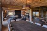 Experience luxury living in this stunning chalet, featuring exquisite wooden interiors and a cozy fireplace.