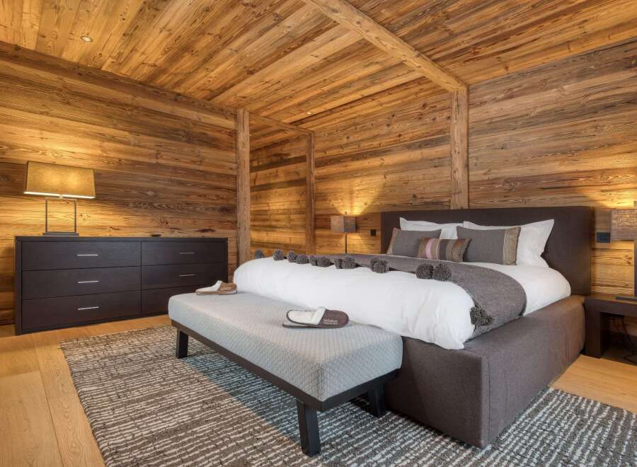 Experience the ultimate in rustic luxury in this stunning bedroom.
