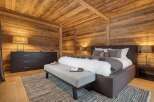 Experience the ultimate in rustic luxury in this stunning bedroom.