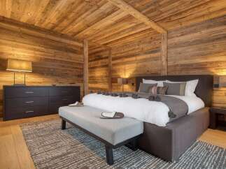 Experience the ultimate in rustic luxury in this stunning bedroom.
