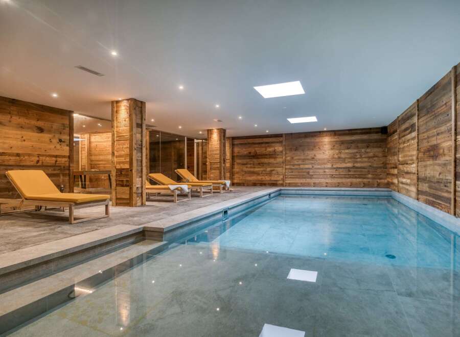 Indulge in luxury at this stunning indoor pool, featuring a sleek design and inviting ambiance.