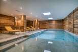Indulge in luxury at this stunning indoor pool, featuring a sleek design and inviting ambiance.