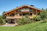 Experience the epitome of alpine luxury in this stunning wooden chalet.