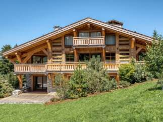 Experience the epitome of alpine luxury in this stunning wooden chalet.