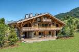 Experience the epitome of alpine luxury in this stunning wooden chalet.
