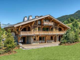 Experience the epitome of alpine luxury in this stunning wooden chalet.