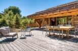 Enjoy the tranquility of this stunning wooden deck, perfect for outdoor gatherings.
