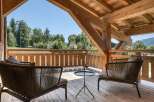 Enjoy the tranquility of this stunning outdoor space, featuring a cozy seating area perfect for relaxation.