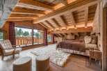 Experience the ultimate in rustic luxury in this stunning bedroom.
