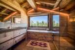 Experience rustic luxury in this stunning bathroom.