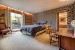 Experience the epitome of rustic elegance in this stunning bedroom.