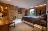 Experience rustic elegance in this stunning bedroom.