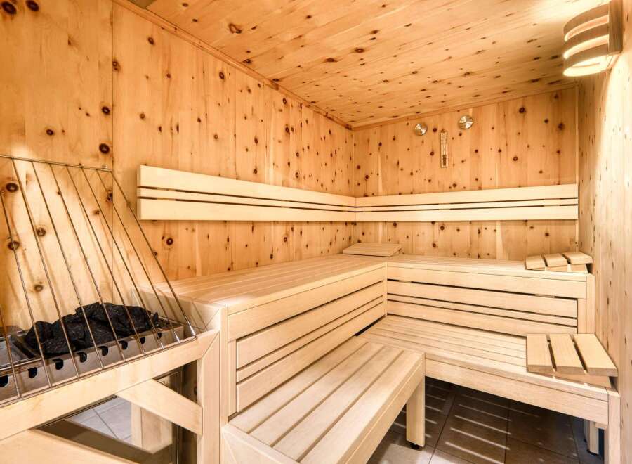Indulge in ultimate relaxation in this exquisite sauna, meticulously crafted from premium light wood.