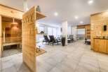 This luxurious spa boasts a stunning sauna with glass doors, offering a relaxing and rejuvenating experience.