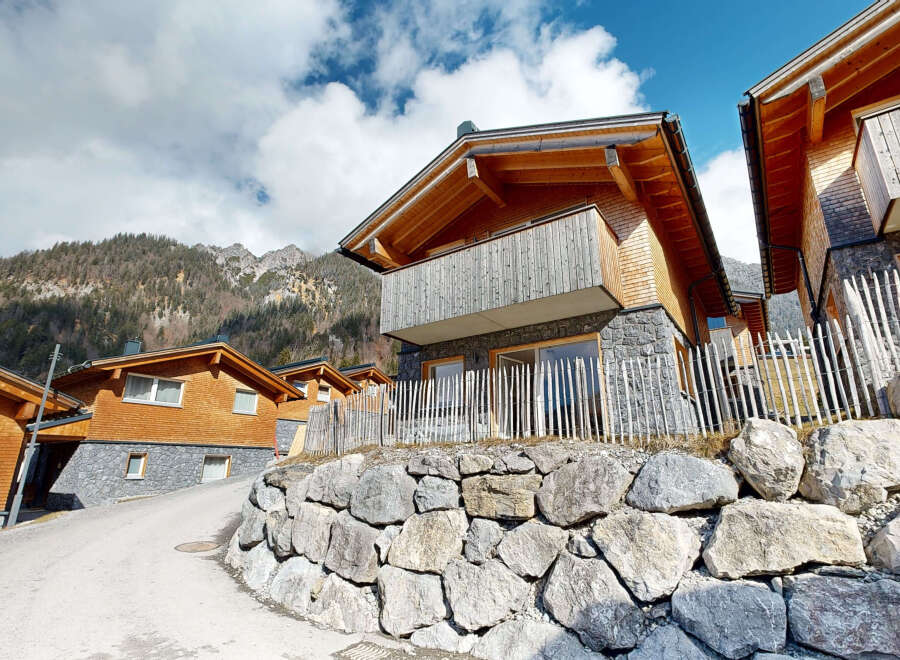 Nestled in a mountainside, this charming chalet boasts stunning views and modern amenities.