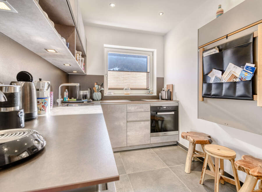 This modern kitchen boasts sleek countertops and ample storage, perfect for culinary enthusiasts.