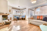 This charming property boasts a cozy living space with a fireplace, perfect for relaxing evenings.