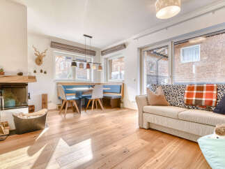 This charming property boasts a cozy living space with a fireplace, perfect for relaxing evenings.