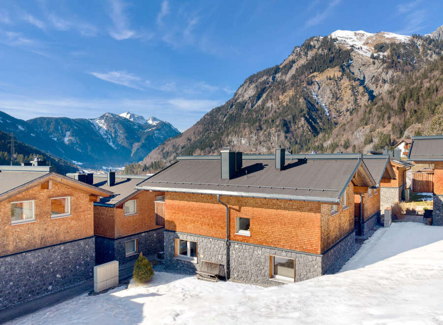 Discover the charm of this stunning mountain property, featuring a unique blend of wood and stone architecture.
