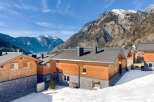 Discover the charm of this stunning mountain property, featuring a unique blend of wood and stone architecture.