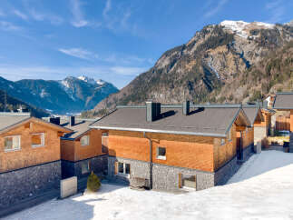 Discover the charm of this stunning mountain property, featuring a unique blend of wood and stone architecture.