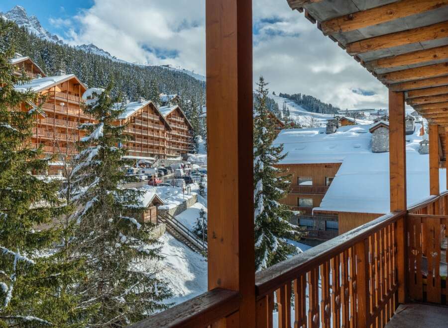 This stunning chalet boasts breathtaking views of the snow-capped mountains and charming village.