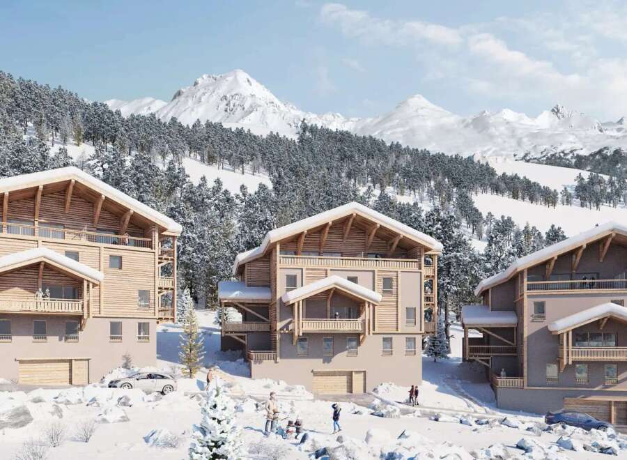 Discover luxurious chalets nestled in a breathtaking snowy mountain setting.