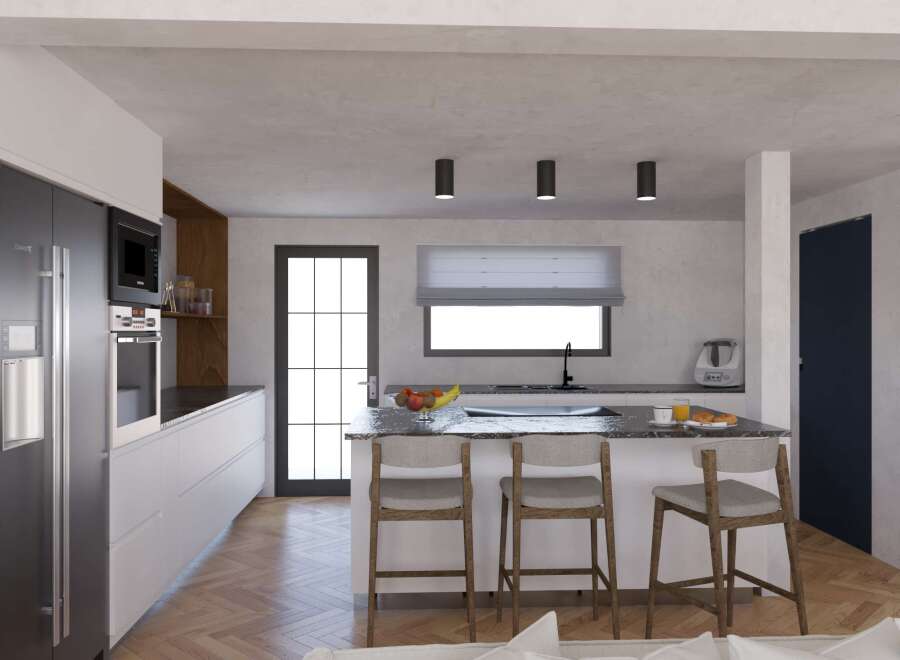 Modern kitchen with herringbone floors and sleek appliances.