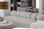 Stunning open-plan living space seamlessly blending modern kitchen and cozy living area.