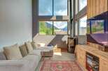Experience modern living with stunning mountain views in this spacious living area.
