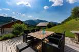 Enjoy breathtaking mountain views from this stunning outdoor patio, perfect for al fresco dining or relaxing with a drink.