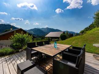 Enjoy breathtaking mountain views from this stunning outdoor patio, perfect for al fresco dining or relaxing with a drink.