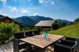 Enjoy breathtaking mountain views from this stunning property's outdoor dining area.
