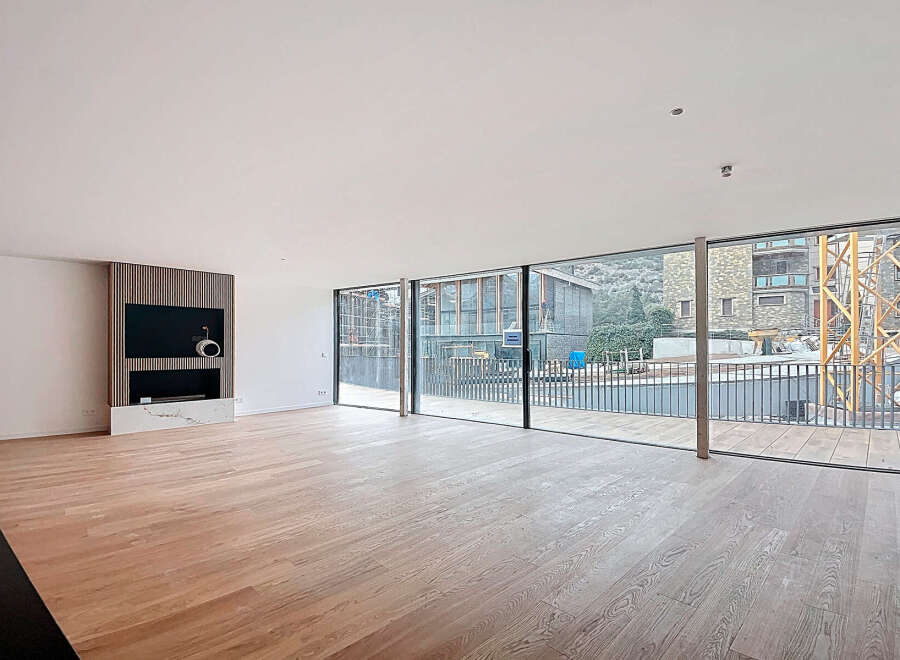 Stunning open-plan living space with expansive windows offering breathtaking views.