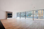 Stunning open-plan living space with expansive windows offering breathtaking views.