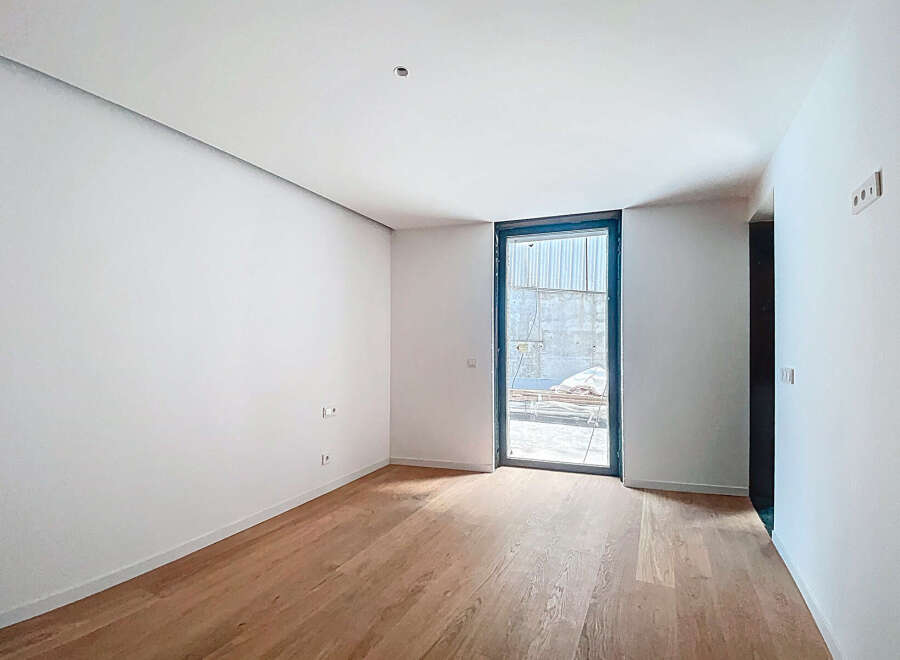 This stunning property boasts a spacious, bright room with gleaming hardwood floors and crisp white walls.