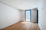 This stunning property boasts a spacious, bright room with gleaming hardwood floors and crisp white walls.