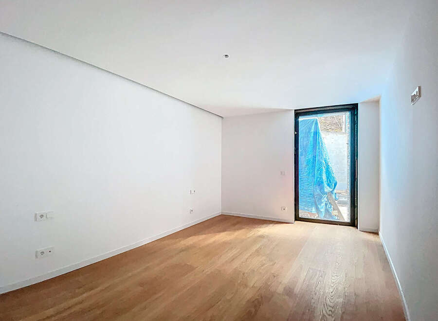 This stunning property boasts a spacious, bright room with gleaming hardwood floors and crisp white walls.