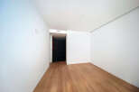 This stunning property boasts a spacious, bright room with gleaming hardwood floors and crisp white walls.