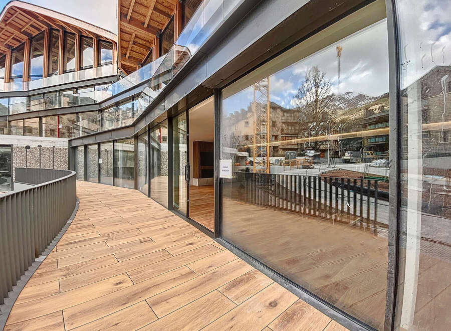 This stunning property boasts a unique architectural design with expansive windows offering breathtaking views.