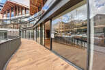 This stunning property boasts a unique architectural design with expansive windows offering breathtaking views.