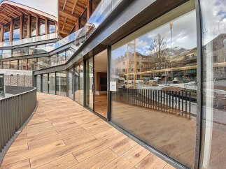 This stunning property boasts a unique architectural design with expansive windows offering breathtaking views.